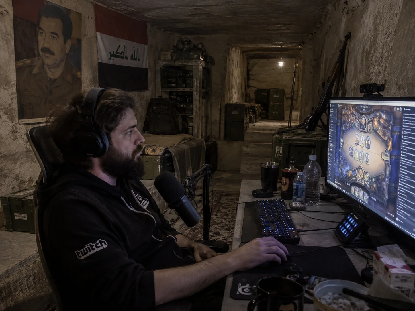 Forsen plays Hearthstone at a makeshift streaming desk inside Saddam Hussein’s dim underground hideout.