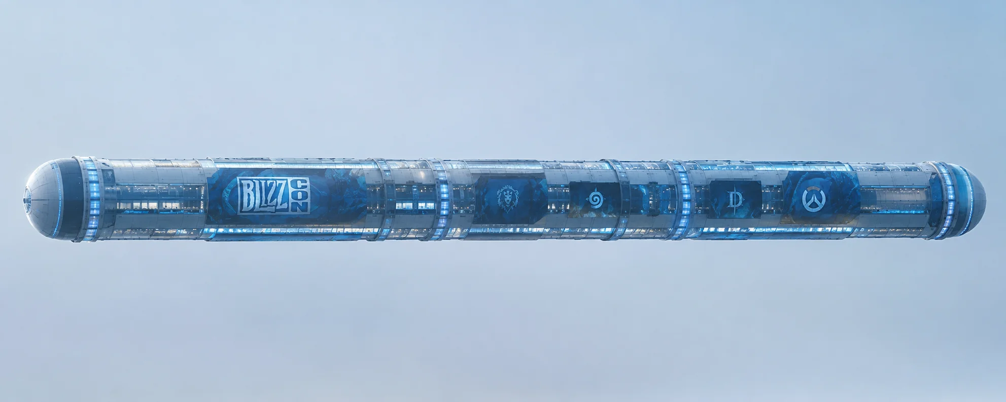 An enormous futuristic cylindrical BlizzCon venue with sleek metallic panels and blue-white lights floats horizontally, isolated in a pale atmospheric space.